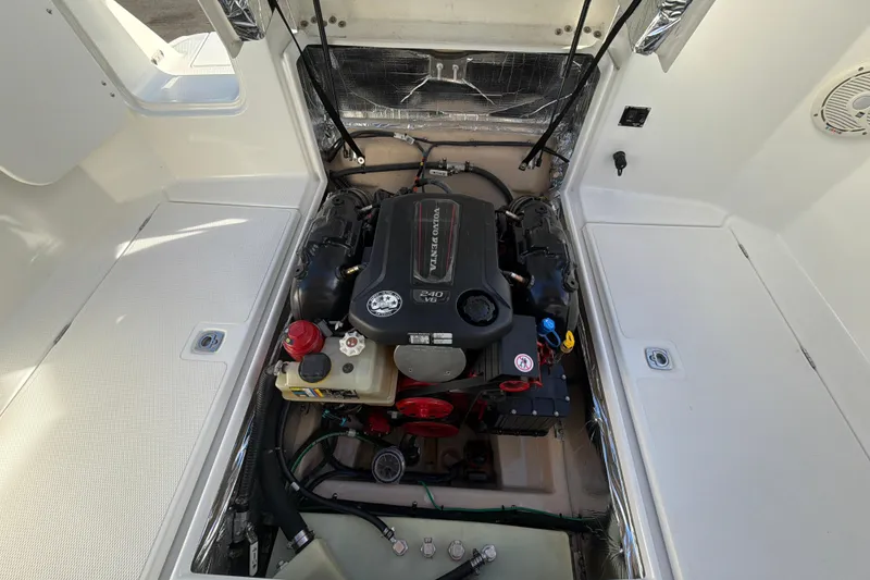 Slide: The Image of Engine compartment of a 2016 Cutwater C-242 Coupe boat, showcasing detailed components. - 47