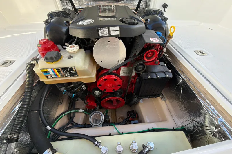 Slide: The Image of Engine compartment of a 2016 Cutwater C-242 Coupe boat, featuring a Volvo Penta engine. - 48