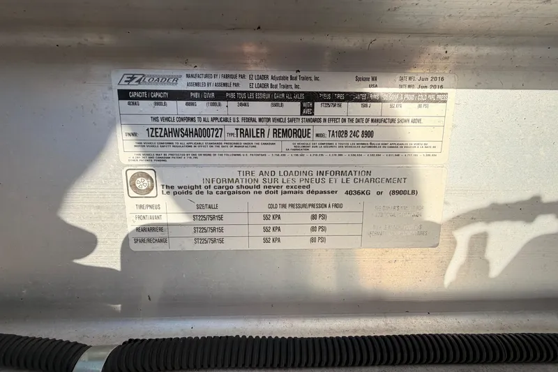 Slide: The Image of Label on a 2016 Cutwater C-242 Coupe trailer, showing tire and loading information. - 54