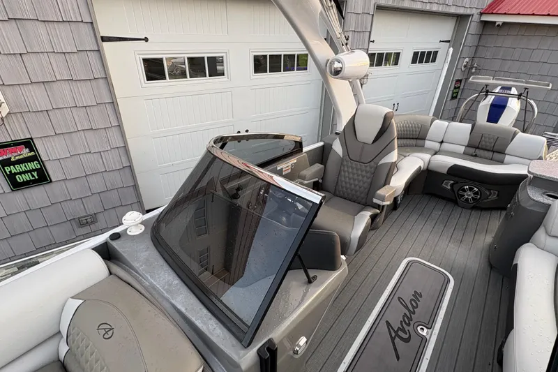 Slide: The Image of 2023 Avalon Excalibur 2585 Windshield Elite boat interior with luxury seating and modern design. - 11