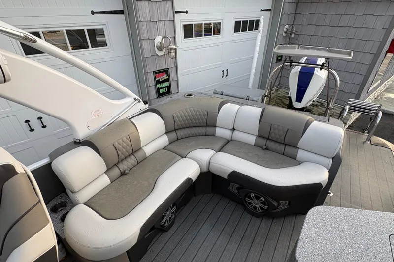 Slide: The Image of Luxurious seating on 2023 Avalon Excalibur 2585 Windshield Elite Tri Toon boat. - 13