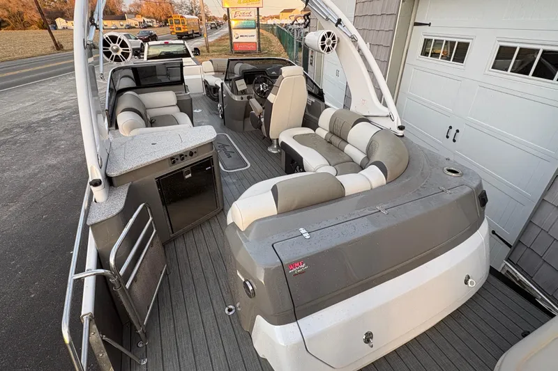 Slide: The Image of 2023 Avalon Excalibur 2585 Windshield Elite boat with luxurious seating and modern design. - 17