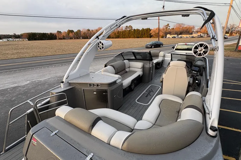 Slide: The Image of 2023 Avalon Excalibur 2585 Windshield Elite Tri Toon boat interior with luxurious seating. - 18