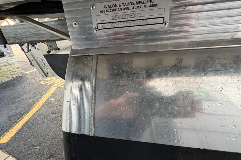 Slide: The Image of Close-up of 2023 Avalon Excalibur 2585 Windshield Elite boat with manufacturer plate. - 20