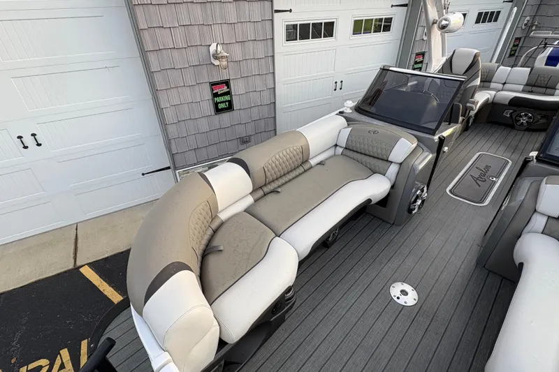 Slide: The Image of 2023 Avalon Excalibur 2585 Windshield Elite boat interior with luxurious seating and modern design. - 9