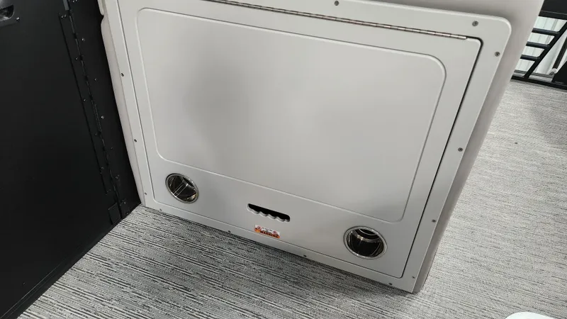 Slide: The Image of Interior view of a 2026 Sylvan L3 SLZ with gray flooring and a white panel. - 21