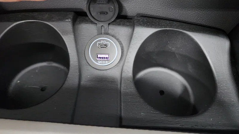 Slide: The Image of Close-up of USB ports and cup holders in a boat. - 37