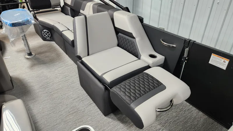 Slide: The Image of Interior of the 2026 Sylvan L3 SLZ with modern, upholstered seating in black and gray. - 16