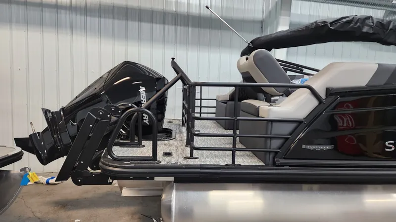 Slide: The Image of The image shows a 2026 Sylvan L3 SLZ pontoon boat with a Mercury outboard motor. - 46