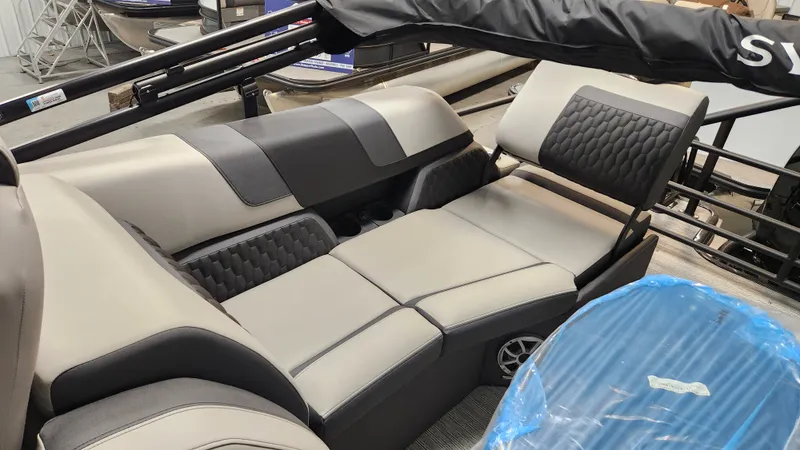 Slide: The Image of Interior view of a 2026 Sylvan L3 SLZ with sleek, cushioned seating in gray and black. - 14