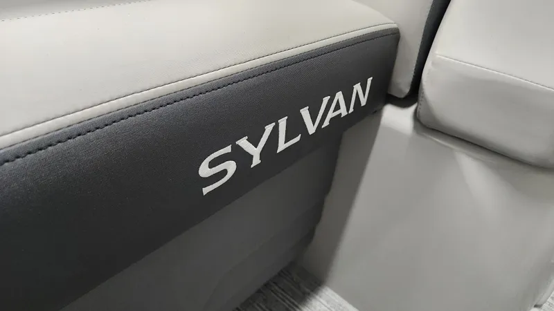 Slide: The Image of Close-up of a gray seat with the Sylvan logo. - 33