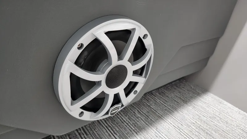 Slide: The Image of Close-up of a speaker in a boat, mounted in a gray wall. - 35