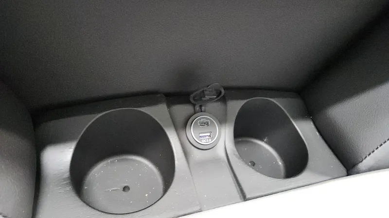 Slide: The Image of Two cup holders and a USB port in a Sylvan L3 SLZ boat. - 34