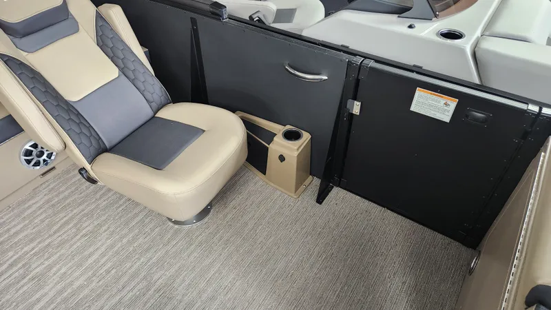 Slide: The Image of Interior of a 2026 Sylvan L3 DLZ with beige seating and gray accents. - 15