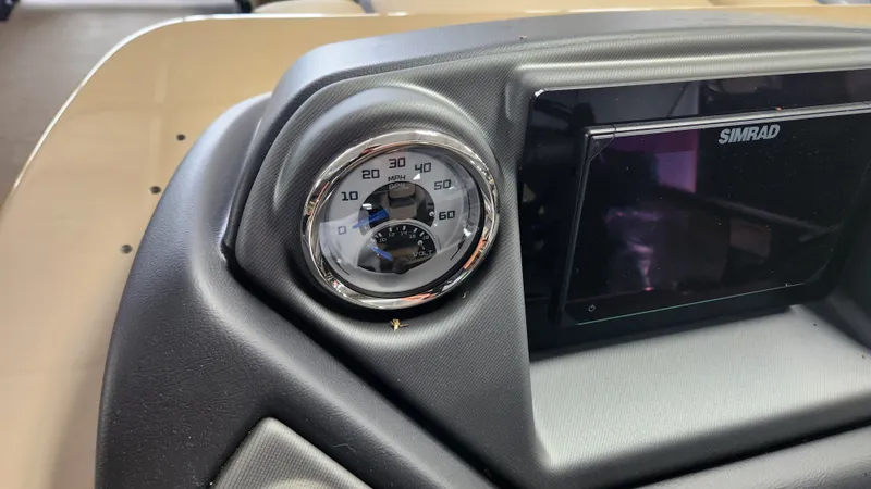 Slide: The Image of Close-up of a speedometer and Simrad screen on a Sylvan L3 DLZ boat. - 18