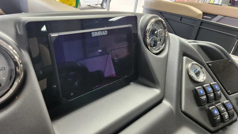Slide: The Image of The image shows the dashboard of a Sylvan L3 DLZ boat with a Simrad display. - 19