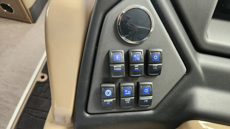 Slide: The Image of Dashboard of a Sylvan L3 DLZ boat with various switches. - 22