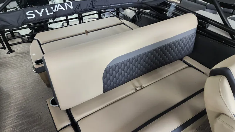 Slide: The Image of Interior of a Sylvan L3 DLZ boat with beige and gray seating. - 25