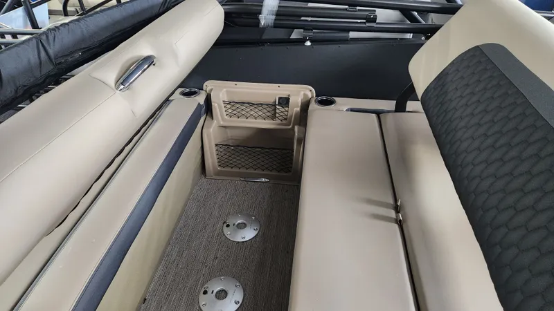 Slide: The Image of Interior of a 2026 Sylvan L3 DLZ with beige seating and carpeted floor. - 29