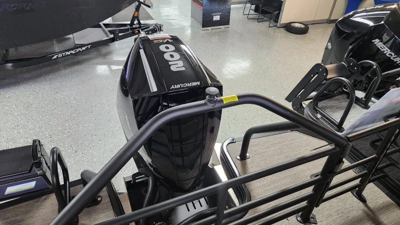 Slide: The Image of A Mercury 200 HP outboard motor is attached to a boat in a showroom setting. - 31