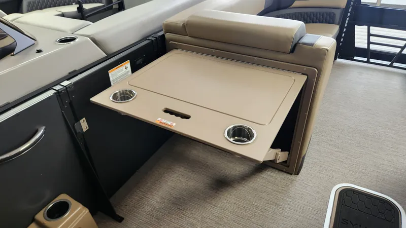 Slide: The Image of A foldable table with cup holders on a boat. - 36