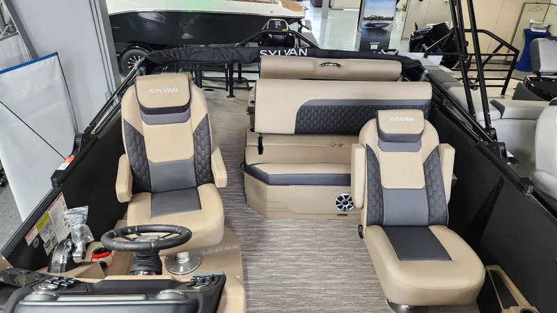 Slide: The Image of Interior of a 2026 Sylvan L3 DLZ with beige and gray seating. - 39