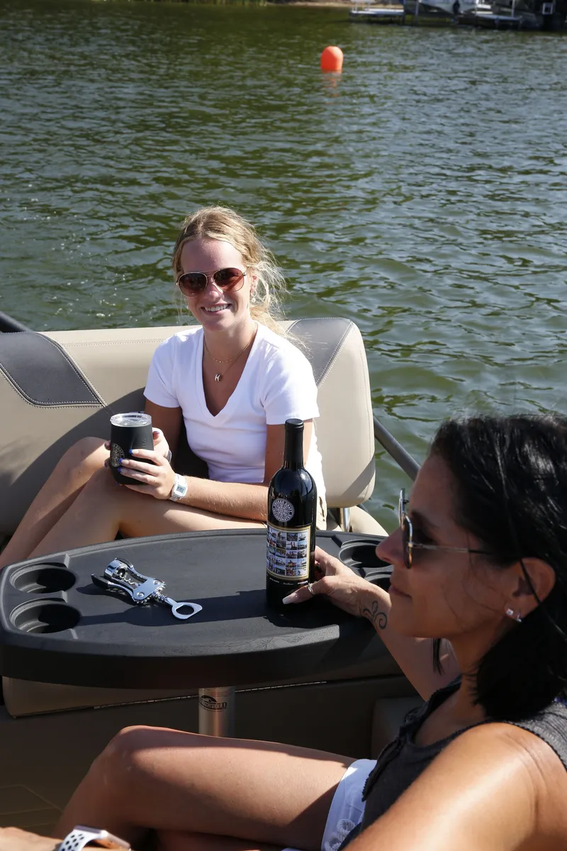 Slide: The Image of Two women relaxing on a 2026 Sylvan L-3 RLZ boat. - 7