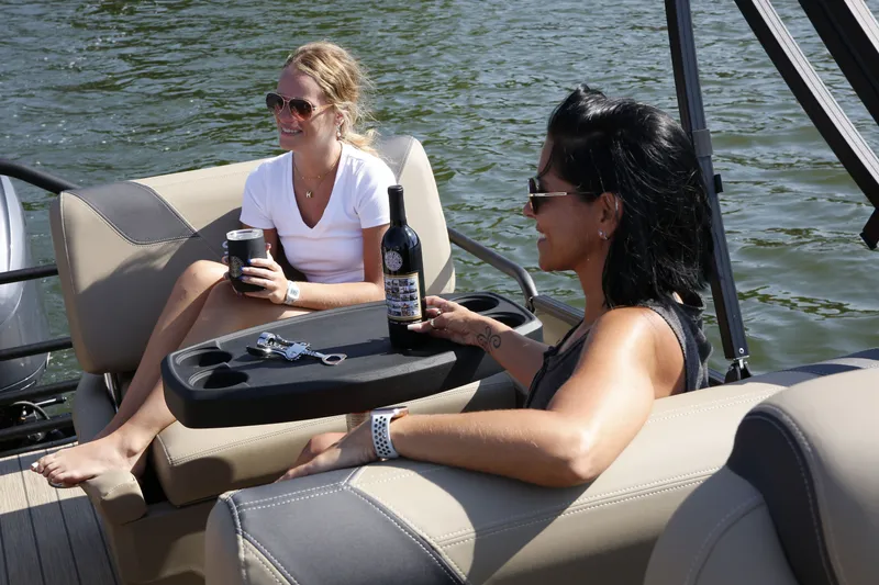 Slide: The Image of Two women relaxing on a 2026 Sylvan L-3 RLZ boat. - 8