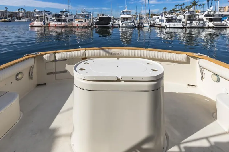 Slide: The Image of 1987 Californian 48 Convertible yacht stern view at marina with boats in background. - 12