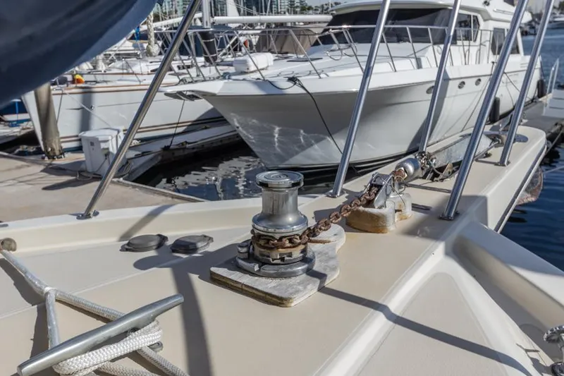 Slide: The Image of 1987 Californian 48 Convertible yacht docked at marina. - 14