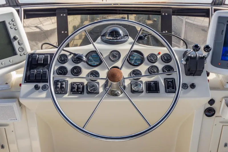 Slide: The Image of Helm of 1987 Californian 48 Convertible yacht with navigation instruments. - 21