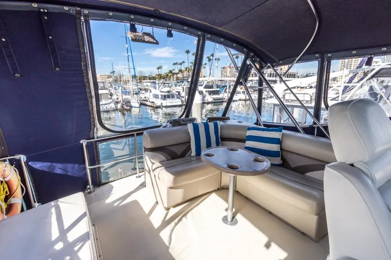 Slide: The Image of 1987 Californian 48 Convertible yacht interior with marina view. - 25