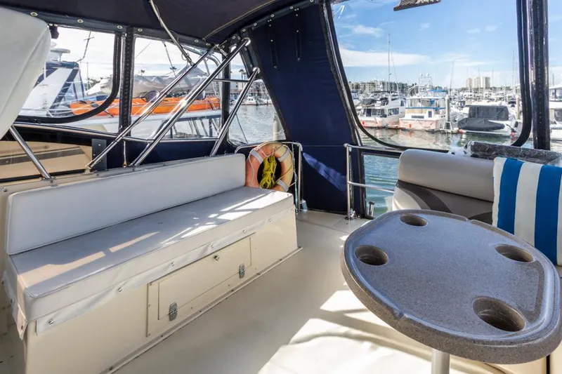 Slide: The Image of Interior of 1987 Californian 48 Convertible yacht with marina view. - 26