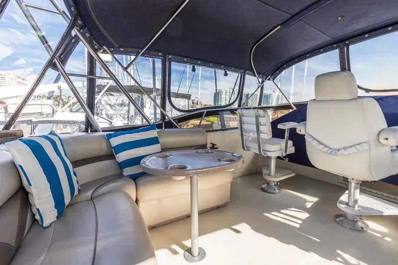 Slide: The Image of Interior of 1987 Californian 48 Convertible yacht with seating and helm chairs. - 27