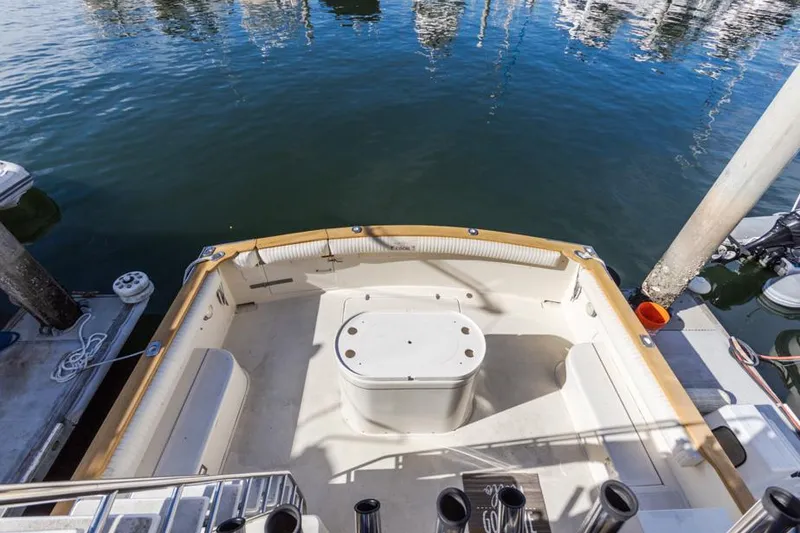 Slide: The Image of 1987 Californian 48 Convertible boat stern view at marina. - 29