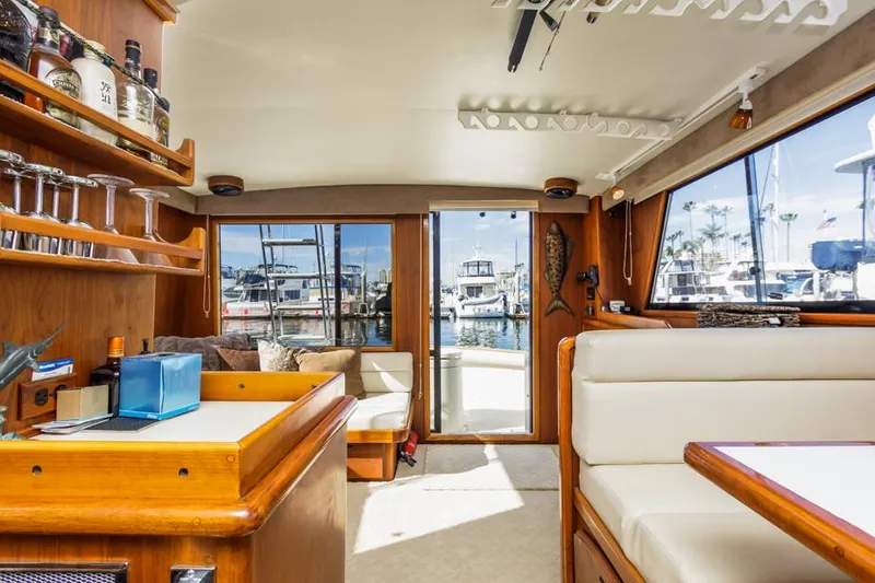 Slide: The Image of Interior of 1987 Californian 48 Convertible yacht with marina view. - 48