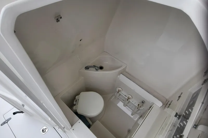 Slide: The Image of Interior of 2004 Jupiter 31 Center Console with toilet. - 12