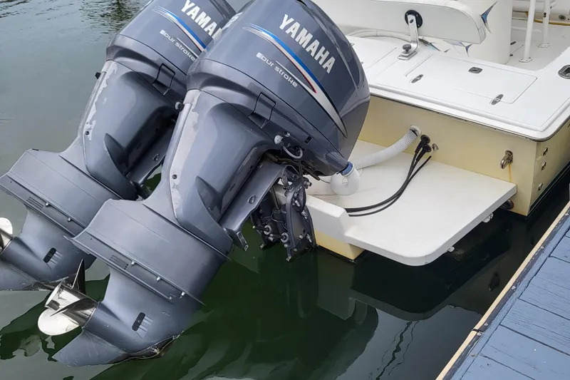 Slide: The Image of Yamaha outboard motors on a 2004 Jupiter 31 Center Console boat. - 3