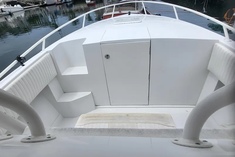 Slide: The Image of 2004 Jupiter 31 Center Console boat, foredeck view in harbor. - 6