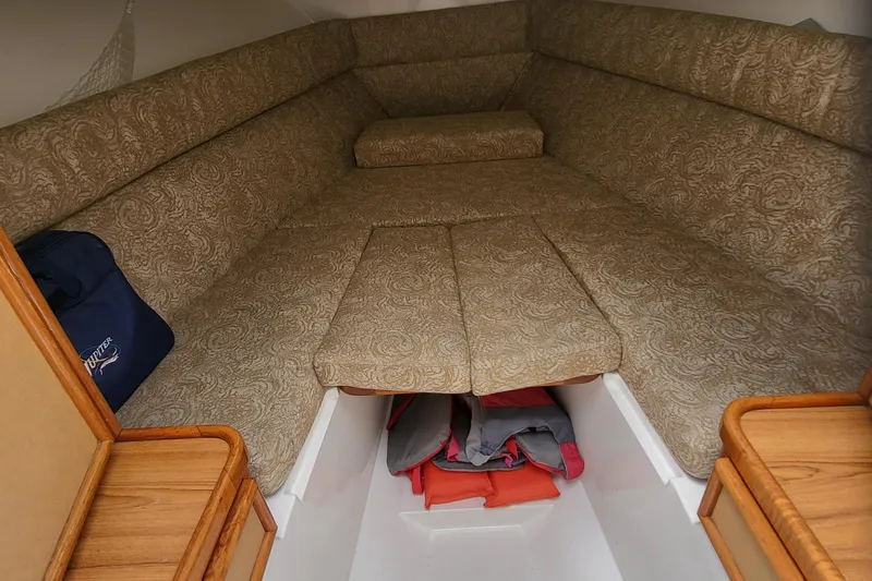 Slide: The Image of Interior of a 2004 Jupiter 31 Center Console boat with upholstery. - 7