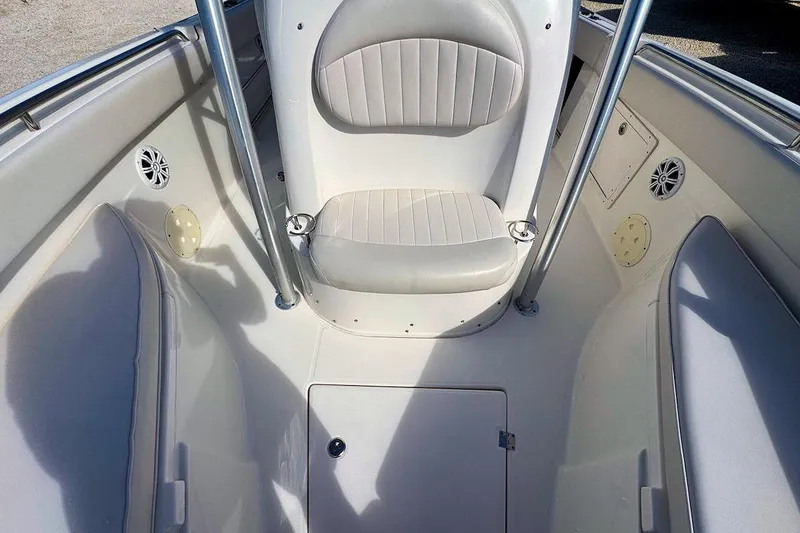 Slide: The Image of 2007 Robalo R240 Center Console boat interior with seating and storage compartments. - 14