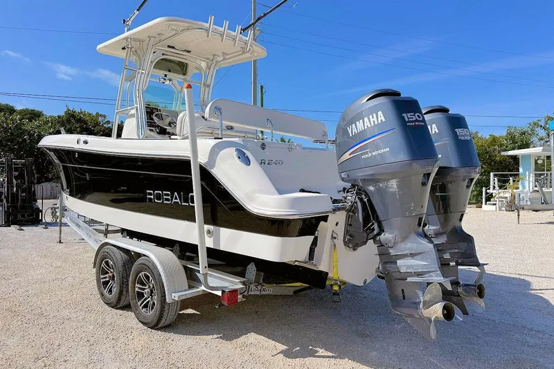 Slide: The Image of 2007 Robalo R240 Center Console boat with twin Yamaha 150 engines on a trailer. - 3