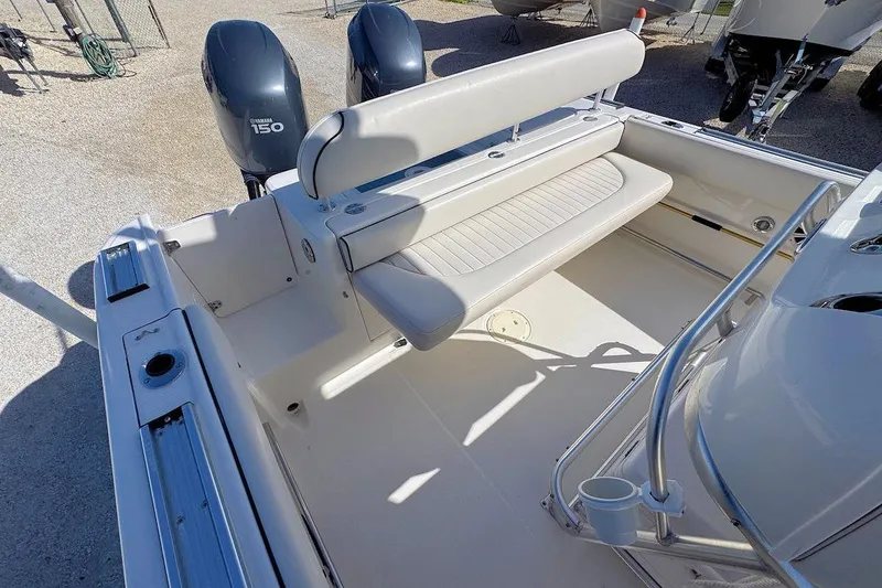 Slide: The Image of 2007 Robalo R240 Center Console boat with dual Yamaha 150 engines, featuring spacious seating. - 5