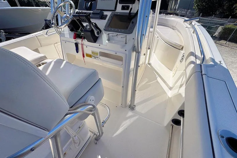Slide: The Image of 2007 Robalo R240 Center Console boat interior with steering wheel and seating. - 7