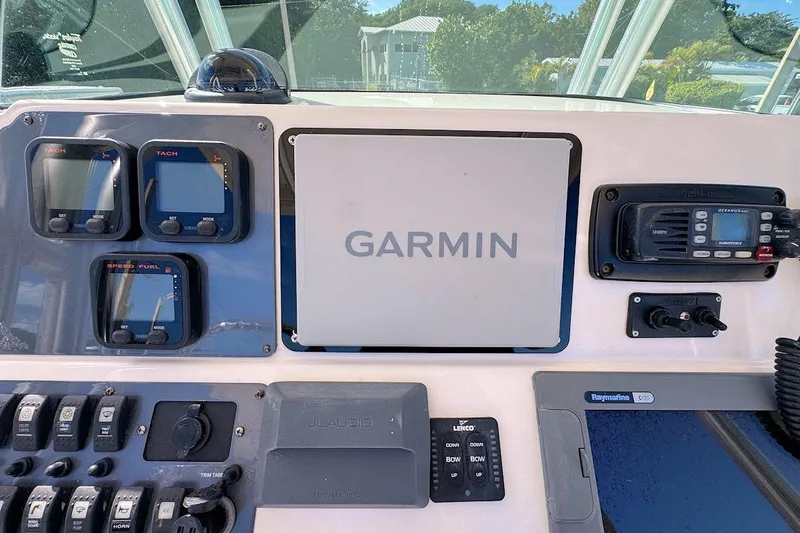 Slide: The Image of 2007 Robalo R240 Center Console dashboard with Garmin navigation and control panels. - 9