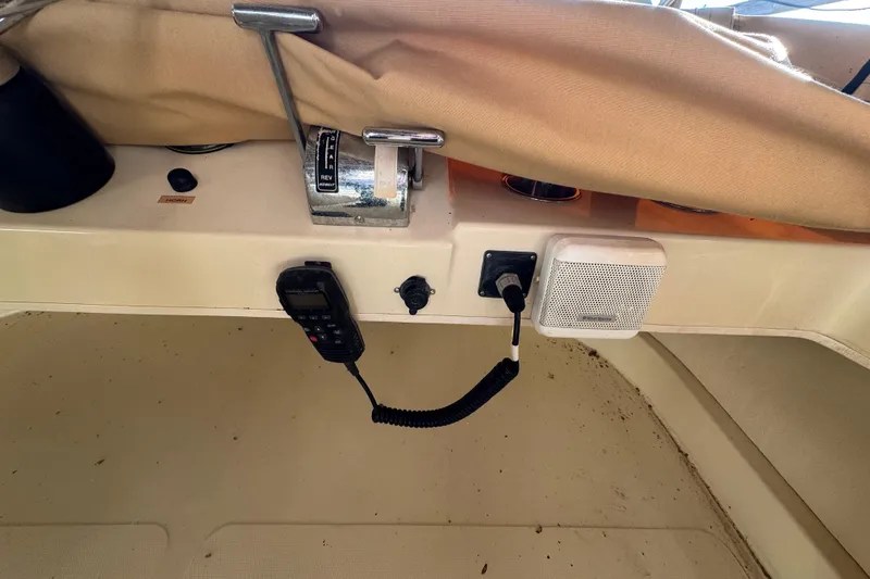 Slide: The Image of Control panel of a 2002 Camano Troller boat with radio and speaker. - 16