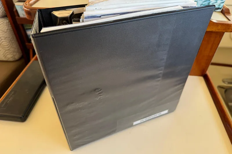 Slide: The Image of Interior of a 2002 Camano Troll 31 boat with seating and helm station. - 18