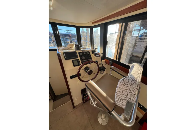 Slide: The Image of Control panel of a 2002 Camano Troller boat with temperature and fan settings. - 23