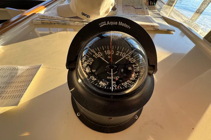 Slide: The Image of 2002 Camano Troller helm with navigation instruments and controls. - 26