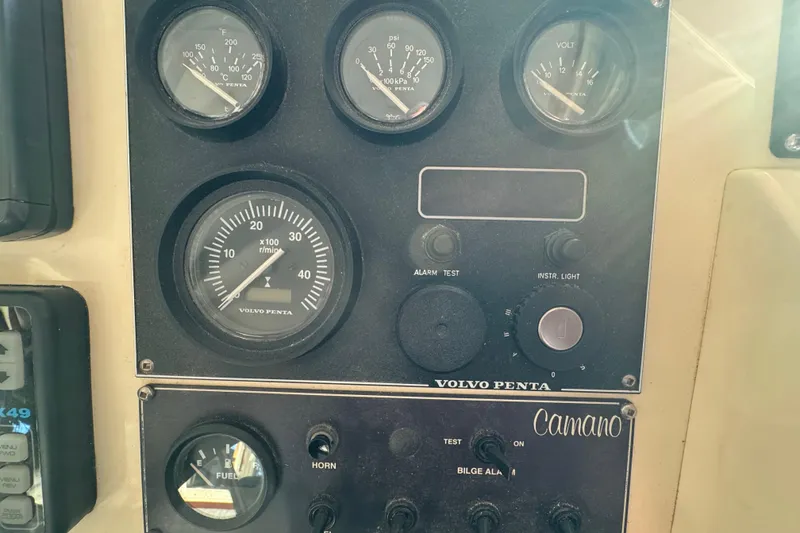 Slide: The Image of Lowrance navigation equipment on a 2002 Camano Troller boat dashboard. - 28
